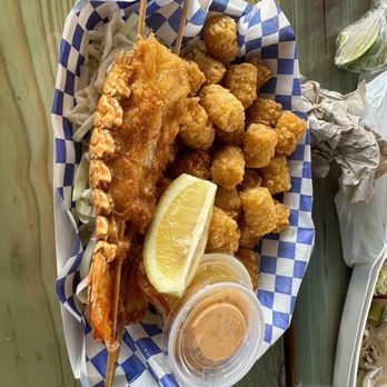 Tasty Caribbean Seafood - Lobster crunchy on the outside and raw on the inside. Tater tots were good. - Food Trucks Near Me - Humble, Texas