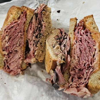Attman's Delicatessen - Lombard Street, toasted rye bread. Regular cut pastrami + corned beef, chopped liver (sweet) and Russian dressing. To go order. - Delis Near Me - Baltimore, Maryland