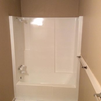 Tubs & Tops - a bathroom with a tile floor - General Contractors Near Me Tubs & Tops - a bathroom with a tile floor - General Contractors Near Me