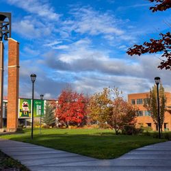 University Of Oregon - The campus green with the bell tower, the Oregon Duck throwing an O and the Library & Learning Center.