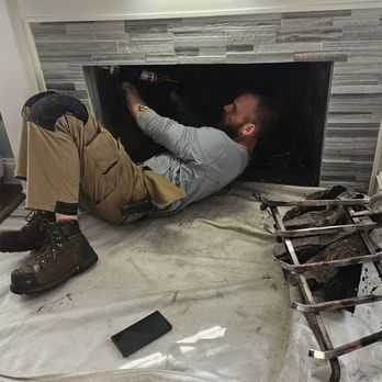Lone Star Chimney - Cleaning the residue left in the fireplace - Chimney Sweeps Near Me - Houston, Texas