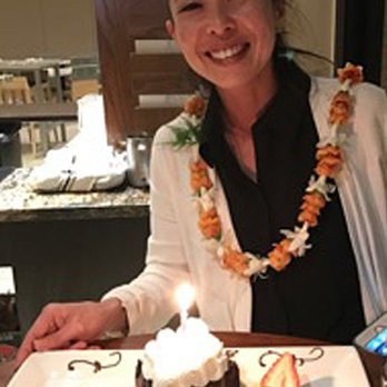 Kuhio Beach Grill - Birthday Girl at Kuhio Beach Grill enjoys a complimentary Chocolate Cake for the occasion! - Breakfast & Brunch Near Me - Honolulu, Hawaii