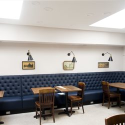 FLOCK - Bistro-style seating with plenty of natural light to work away at a laptop with a cup of hot coffee.