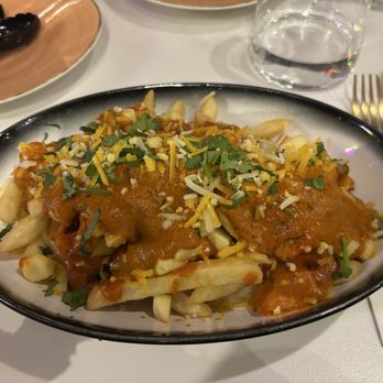 Karma Social Lounge - Butter chicken poutine - Indian Near Me - Milton, Ontario Karma Social Lounge - Butter chicken poutine - Indian Near Me - Milton, Ontario