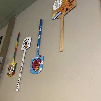 Brickhouse Pizzeria - a variety of items on the wall - Chicken Wings Near Me - Rifle, Colorado