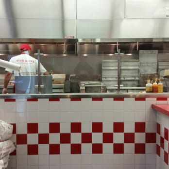 Five Guys - At the grill - Burgers Near Me - Franklin, Massachusetts