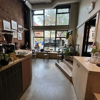 Saint Cecilia - high ceilings, soft light filters through the windows, highlighting clean lines - Coffee & Tea Near Me - Victoria, British Columbia