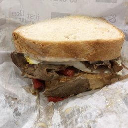 a sandwich with meat and cheese
