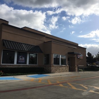 Raising Cane's - the outside of a restaurant - Chicken Wings Near Me - Schertz, Texas