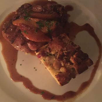 Noah's - Pork Chop with sweetened peaches and quiche. - New American Near Me - Greenport, New York Noah's - Pork Chop with sweetened peaches and quiche. - New American Near Me - Greenport, New York