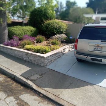 Larry Ferguson's Lawn & Garden Plus - a car parked in the driveway - Landscaping Near Me Larry Ferguson's Lawn & Garden Plus - a car parked in the driveway - Landscaping Near Me