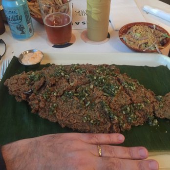 Hello, Sailor - Whole Flounder. Hand for scale and I can Palm a basketball! - Seafood Near Me - Cornelius, North Carolina