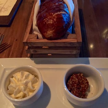 Main + Abbey - Complimentary pretzel bread, with a side of honey walnut butter and Dijon mustard. - Gastropubs Near Me - Sioux City, Iowa Main + Abbey - Complimentary pretzel bread, with a side of honey walnut butter and Dijon mustard. - Gastropubs Near Me - Sioux City, Iowa