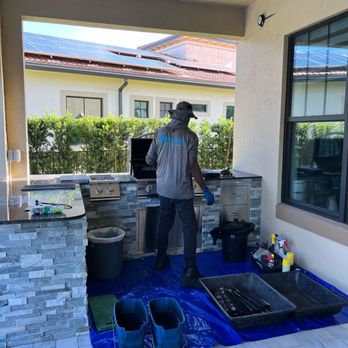 Grilltor - BBQ Grill Care - Grill cleaning technician in action. - Grill Services Near Me Grilltor - BBQ Grill Care - Grill cleaning technician in action. - Grill Services Near Me