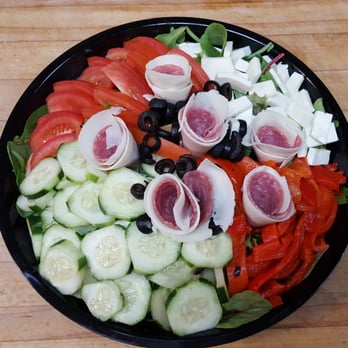 Pizza Yeah - a black plate with a salad of tomatoes, cucumbers, black olives, and ham - Pizza Near Me - Langhorne, Pennsylvania Pizza Yeah - a black plate with a salad of tomatoes, cucumbers, black olives, and ham - Pizza Near Me - Langhorne, Pennsylvania