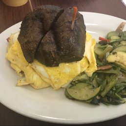 Egg & cheese on pumpernickel with veggies.