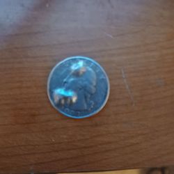 Eagle Coin Stamp & Jewelry - Its a 1993 quarter with like bubble marks of the metal on front and back
