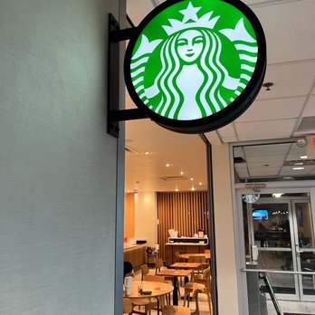 Starbucks - a starbucks sign hanging from the side of a building - Coffee & Tea Near Me - Newark, Ohio Starbucks - a starbucks sign hanging from the side of a building - Coffee & Tea Near Me - Newark, Ohio