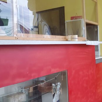 China Moon Carry Out - a red counter and a yellow wall - Chinese Near Me - Towson, Maryland China Moon Carry Out - a red counter and a yellow wall - Chinese Near Me - Towson, Maryland