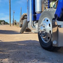 El Coyote Roadside Service - Installing customer steer tire at his pad.