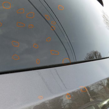 Ardsley Car Wash - Rear of car - It's difficult to photograph, but crusty white specks are circled - Auto Detailing Near Me - Ardsley, New York
