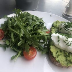 Lilly's Cafe - perfectly poached eggs nestled on creamy avocado atop crunchy sourdough! Yes, it was THAT delicious