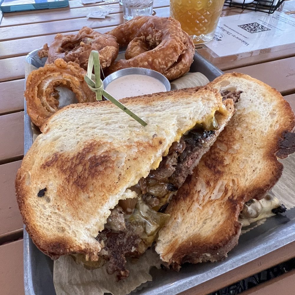 The Burger Social - Philly Patty Melt with onion rings - Bars Near Me - Wheaton, Illinois The Burger Social - Philly Patty Melt with onion rings - Bars Near Me - Wheaton, Illinois