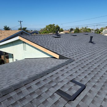 Accurate Roofing Solutions - Roof in front of house - Roofing Near Me