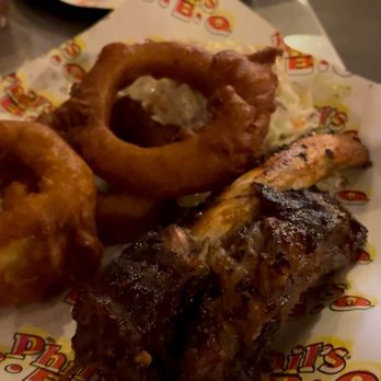 Phil's BBQ - Beef Beefy Rib Tickler (1 Bone) with onion rings and Cole slaw - Barbeque Near Me - San Diego, California Phil's BBQ - Beef Beefy Rib Tickler (1 Bone) with onion rings and Cole slaw - Barbeque Near Me - San Diego, California