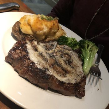 Burtons Grill & Bar - 14oz ribeye, double baked potato, and broccoli - New American Near Me - Sterling, Virginia
