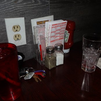 Mr. Mike's Restaurant & Lounge - a table with a glass of soda, salt and pepper shaker - Sandwiches Near Me - Haverhill, Massachusetts