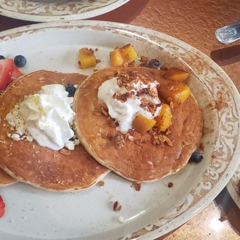 Another Broken Egg Cafe - Pancake Flight with fresh fruit, blueberry lemon, and peach cobbler pancakes. Comes with eggs and choice of meat. - Breakfast & Brunch Near Me - Houston, Texas
