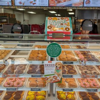 Krispy Kreme - A bountiful choice of delicious donuts with the menu board in the background. - Donuts Near Me - Rockville, Maryland Krispy Kreme - A bountiful choice of delicious donuts with the menu board in the background. - Donuts Near Me - Rockville, Maryland