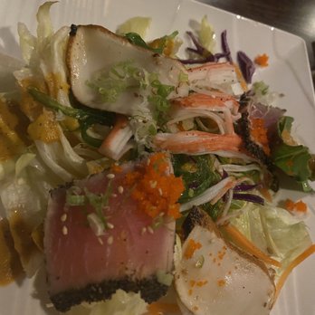 Sushi.com - A dish featuring various sushi and sashimi pieces, including tuna, crab, and fish, served with shredded vegetables and garnishes. - Sushi Bars Near Me - Dublin, Ohio