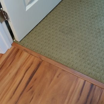 Genuine Carpet Repairs - Re-tacked carpet where it meets the laminate flooring - Carpeting Near Me