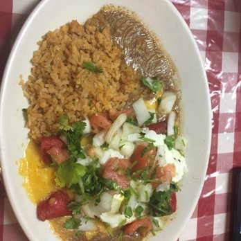 Maria's Cafe - EggChiladas - Beef Enchiladas under an over medium egg w/ Pico de Galo. - Mexican Near Me - San Antonio, Texas Maria's Cafe - EggChiladas - Beef Enchiladas under an over medium egg w/ Pico de Galo. - Mexican Near Me - San Antonio, Texas