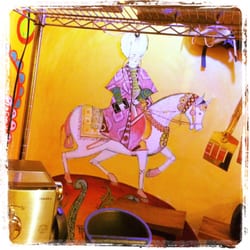 Turbaned Ottoman horseman with iPad and earphones stops by daily for the cafe's espresso and wifi.