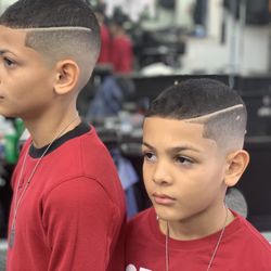 The Taper’s Club - This is a picture of a haircut from a barber in this barbershop.   -BabyBryan