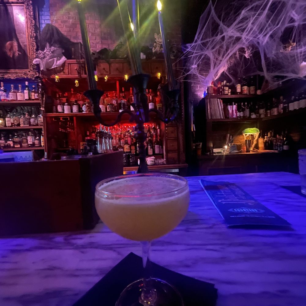 The Courtesy - Bow and Arrow Not on the menu, its Mezcal and bourbon, with cinnamon. Beautifully blended, with citrus and pineapple. Just yummy. - Cocktail Bars Near Me - Winter Park, Florida The Courtesy - Bow and Arrow Not on the menu, its Mezcal and bourbon, with cinnamon. Beautifully blended, with citrus and pineapple. Just yummy. - Cocktail Bars Near Me - Winter Park, Florida
