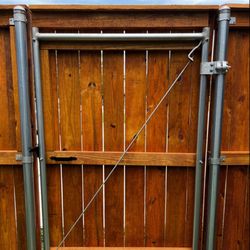 Butler Contracting - Metal framed wooden privacy fence gate.