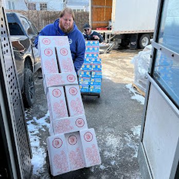 Rainbow Liquor - a man carrying a cart full of boxes - Beer, Wine & Spirits Near Me - Ferndale, Michigan