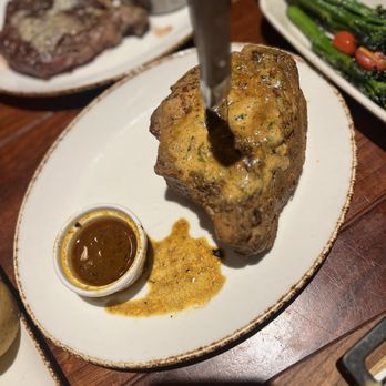 The Ranch - 24 hour sous vide   Mesquite Grilled Double Cut Bone in Pork Chop - Steakhouses Near Me - Irving, Texas