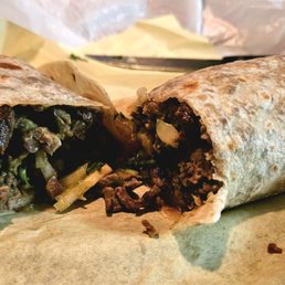 Carne asada burrito cut in half (to-go order)