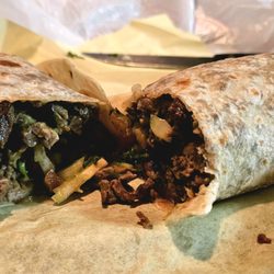 Rodolfo's Mexican Grill - Carne asada burrito cut in half (to-go order)