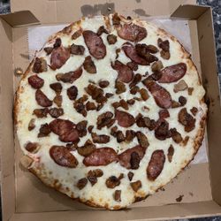 Tato's Pizzeria and Restaurant - Columbian pizza comes with bacon, sausage & plantains