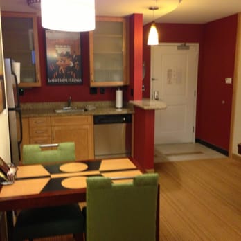 Residence Inn Charlotte Concord - Dishwasher and cute little dining table w green chairs...another view of the kitchen - Hotels Near Me - Concord, North Carolina Residence Inn Charlotte Concord - Dishwasher and cute little dining table w green chairs...another view of the kitchen - Hotels Near Me - Concord, North Carolina