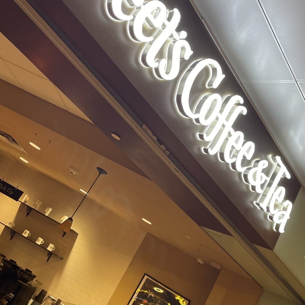 the entrance to a coffee shop