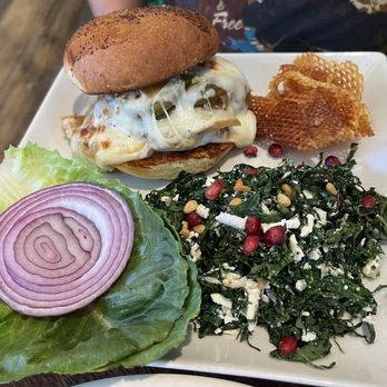 Cafe Pasqual's - Bison burger with side of Tuscan kale salad - Vegetarian Near Me - Santa Fe, New Mexico Cafe Pasqual's - Bison burger with side of Tuscan kale salad - Vegetarian Near Me - Santa Fe, New Mexico