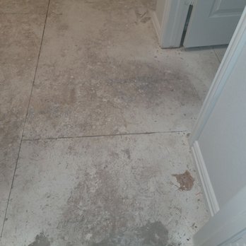 Brightland Homes - Floor is warped, buckling and isn't leveled - Home Developers Near Me - Addison, Texas