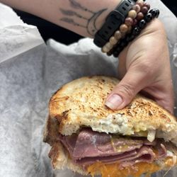 Larch sandwich. Pastrami, blue cheese, dill pickles, cheese and mustard.